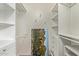 Spacious closet with custom shelving and storage, and an artistic wall hanging at 1006 E Osborn Rd # B, Phoenix, AZ 85014