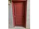 A solid-red front door with classic panel detailing and stylish hardware, ensuring a secure entry at 1006 E Osborn Rd # B, Phoenix, AZ 85014