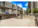 A furnished outdoor patio with seating, offering a relaxing space with a view of the surrounding building at 1006 E Osborn Rd # B, Phoenix, AZ 85014