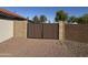 Back yard wooden gate for back yard access and fenced in yard at 1120 S Valley Dr, Apache Junction, AZ 85120