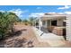 Covered patio features a hot tub, offering a perfect spot for relaxation at 1120 S Valley Dr, Apache Junction, AZ 85120