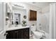 Bathroom showcasing a granite countertop vanity, shower/tub combo, and a cabinet at 1120 S Valley Dr, Apache Junction, AZ 85120