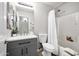 Bathroom features a shower/tub combo, a modern vanity, and decorative accents at 1120 S Valley Dr, Apache Junction, AZ 85120