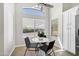 Cozy kitchen nook featuring a white round table beneath a large window for sunlit dining at 1120 S Valley Dr, Apache Junction, AZ 85120