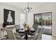 Charming dining area with elegant lighting, a modern table, and patio access at 1120 S Valley Dr, Apache Junction, AZ 85120