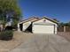 Charming single-story home featuring a two-car garage and low maintenance landscaping at 1120 S Valley Dr, Apache Junction, AZ 85120