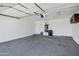 Spacious two-car garage with ample room for parking and storage, plus a water heater at 1120 S Valley Dr, Apache Junction, AZ 85120