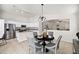 Bright, open kitchen with stainless steel appliances and eat-in dining area for casual meals at 1120 S Valley Dr, Apache Junction, AZ 85120