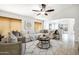 Inviting living room with a ceiling fan, comfortable seating, and tile flooring at 1120 S Valley Dr, Apache Junction, AZ 85120