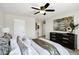 Comfortable bedroom featuring neutral walls, ceiling fan, and a dark wood dresser at 1120 S Valley Dr, Apache Junction, AZ 85120