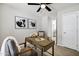 Cozy home office space with modern artwork, a comfortable chair, and ample natural light at 1120 S Valley Dr, Apache Junction, AZ 85120