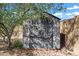 Backyard features a wooden storage shed with double doors and windows at 1120 S Valley Dr, Apache Junction, AZ 85120