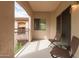 Balcony with two patio chairs and a table overlooking complex at 16801 N 94Th St # 2056, Scottsdale, AZ 85260