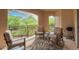 Comfortable covered balcony furnished for outdoor relaxation and dining at 16801 N 94Th St # 2056, Scottsdale, AZ 85260
