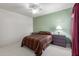 Simple bedroom featuring a ceiling fan, neutral carpets, and a comfortable oversized bed at 16801 N 94Th St # 2056, Scottsdale, AZ 85260