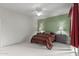 Relaxing bedroom featuring two toned paint, a ceiling fan, and an oversized bed frame at 16801 N 94Th St # 2056, Scottsdale, AZ 85260