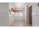 Cozy dining area with tile flooring, natural light, and a built-in storage cabinet adjacent to kitchen at 16801 N 94Th St # 2056, Scottsdale, AZ 85260
