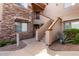 Inviting condo exterior with stone accents and meticulously maintained desert landscaping at 16801 N 94Th St # 2056, Scottsdale, AZ 85260