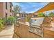 Outdoor gas grill area with shade covering and community landscaping at 16801 N 94Th St # 2056, Scottsdale, AZ 85260