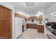 The well-lit kitchen with essential appliances and tiled floors at 16801 N 94Th St # 2056, Scottsdale, AZ 85260