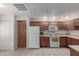 The well-lit kitchen offers essential appliances and ample cabinet space at 16801 N 94Th St # 2056, Scottsdale, AZ 85260