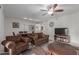 Open-concept living room with modern ceiling fan, a TV and lots of natural light at 16801 N 94Th St # 2056, Scottsdale, AZ 85260