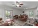 The spacious living room with modern ceiling fan and balcony access at 16801 N 94Th St # 2056, Scottsdale, AZ 85260