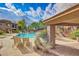 The refreshing community pool with sun loungers and a shaded seating area at 16801 N 94Th St # 2056, Scottsdale, AZ 85260