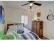 Cozy bedroom features southwest-inspired decor and shuttered windows for natural light at 1701 W Clarendon Ave, Phoenix, AZ 85015