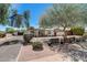 Inviting home with mature trees, decorative metal fencing, and desert landscaping for a unique curb appeal at 1701 W Clarendon Ave, Phoenix, AZ 85015