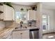Charming kitchen features granite counters, stainless appliances, and bright natural light at 1701 W Clarendon Ave, Phoenix, AZ 85015
