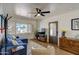Inviting living room with stylish furniture, a ceiling fan, and a window with shutters providing ample natural light at 1701 W Clarendon Ave, Phoenix, AZ 85015
