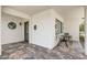 Cozy outdoor patio with tiled flooring and a seating area, creating a relaxing spot to enjoy the outdoors at 1701 W Clarendon Ave, Phoenix, AZ 85015