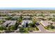 Neighborhood aerial view of desert home with mature tree landscaping in well maintained community at 17690 E Bronco Dr, Queen Creek, AZ 85142