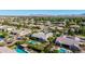 Gorgeous aerial view of neighborhood homes, pools, and desert mountain backdrop at 17690 E Bronco Dr, Queen Creek, AZ 85142