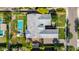 Aerial view showcasing gray roof with pool and manicured backyard with patio and lounge furniture at 17690 E Bronco Dr, Queen Creek, AZ 85142