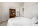 Bedroom featuring a comfortable bed, hardwood floors, and an antique book case at 17690 E Bronco Dr, Queen Creek, AZ 85142