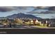 Elegant community entrance with mountain views, showcasing a serene and inviting neighborhood at 17690 E Bronco Dr, Queen Creek, AZ 85142