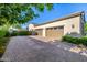 Large driveway with ample parking space, leading to a three-car garage at 17690 E Bronco Dr, Queen Creek, AZ 85142