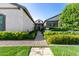 Attractive home exterior with a stone pathway, lush landscaping, and a welcoming entrance at 17690 E Bronco Dr, Queen Creek, AZ 85142