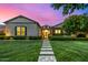 Charming single-story home with a beautifully landscaped front yard and inviting entrance pathway at 17690 E Bronco Dr, Queen Creek, AZ 85142