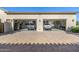 Clean and organized three-car garage with cars, epoxied floors, and decorations at 17690 E Bronco Dr, Queen Creek, AZ 85142