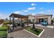 Beautiful backyard with a pergola-covered seating area, a water feature, and outdoor dining set at 18225 N 66Th Way, Phoenix, AZ 85054
