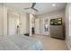 Well-lit bedroom with access to the backyard, neutral walls, and a ceiling fan at 18225 N 66Th Way, Phoenix, AZ 85054