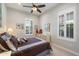 Cozy bedroom with neutral walls, a ceiling fan, shuttered windows and carpeted floors at 18225 N 66Th Way, Phoenix, AZ 85054