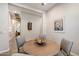 Dining room featuring a round table, four chairs, and stylish decor at 18225 N 66Th Way, Phoenix, AZ 85054