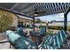 Inviting outdoor patio with fire pit, comfortable seating, and stylish pergola for relaxing and entertaining at 18225 N 66Th Way, Phoenix, AZ 85054