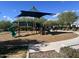 Community playground featuring modern equipment and shade structure for hours of outdoor fun at 18225 N 66Th Way, Phoenix, AZ 85054