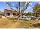 Large backyard featuring a pool, firepit, mature landscaping, and patio area at 1943 E Drake Dr, Tempe, AZ 85283