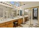 Bright primary bathroom with dual vanities, tile floors, and mirrored wardrobe at 1943 E Drake Dr, Tempe, AZ 85283